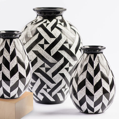 Hand-etched ceramic vessel in black and white geometric designs