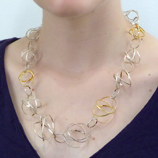 Kathleen Maley silver and gold vermeil graduated Mobius charms necklace