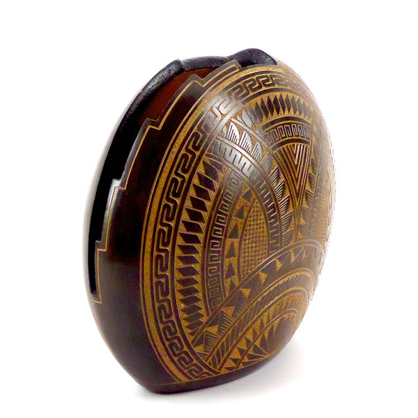 Ceramic upright disc vessel with hand-cut geometric design