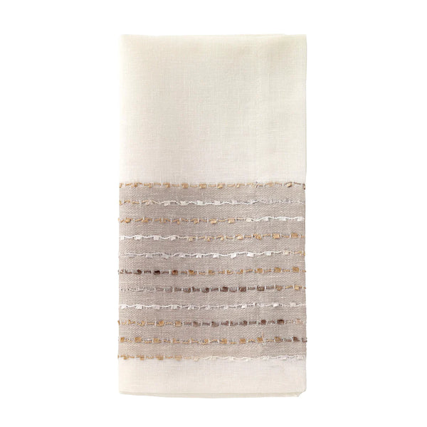 Bodrum Odyssey napkins and runners with metallic confetti accents