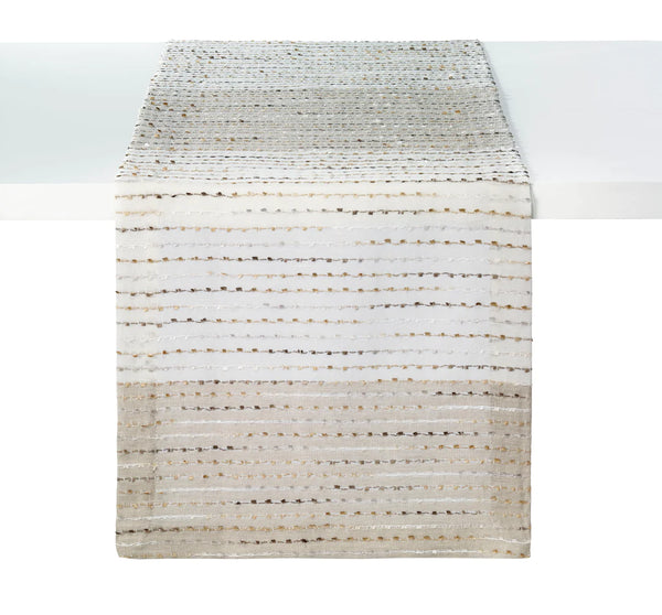 Bodrum Odyssey napkins and runners with metallic confetti accents