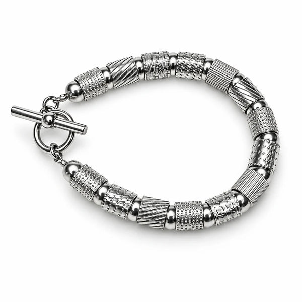 Textured tubes and balls bracelet in silver, rhodium, and black