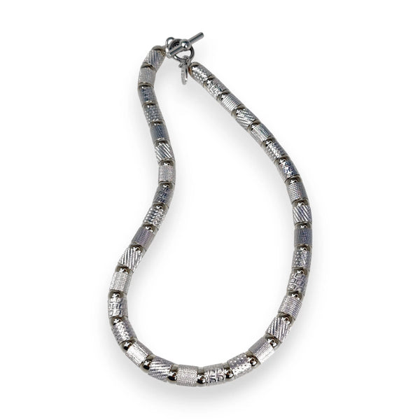 Textured tubes and balls necklace in silver, rhodium, and black