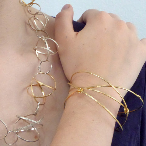 Kathleen Maley gold vermeil crossing textured bands orbit bracelet