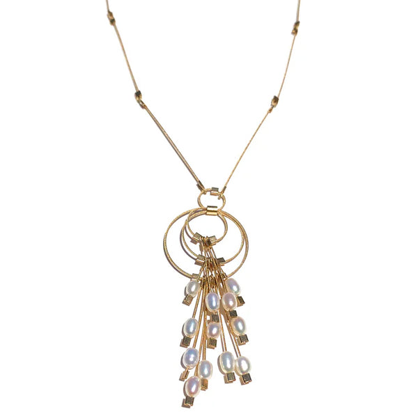 Gold rings with white pearls pendent necklace by Meghan Patrice Riley