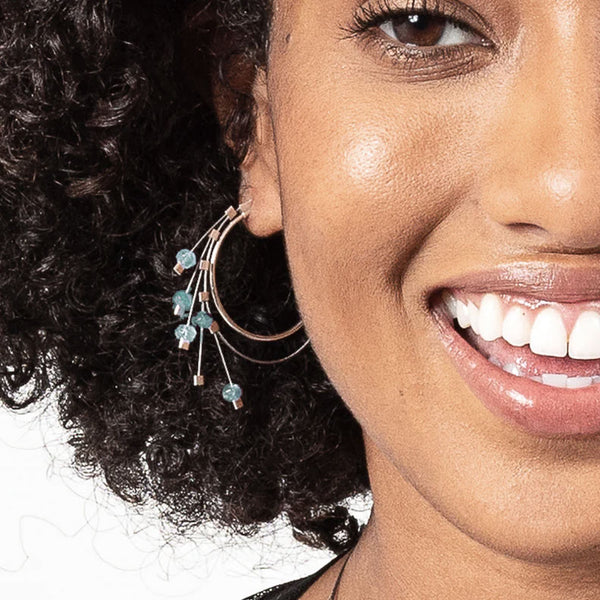 Endless spring hoop earrings in silver and aquamarine by Meghan Patrice Riley