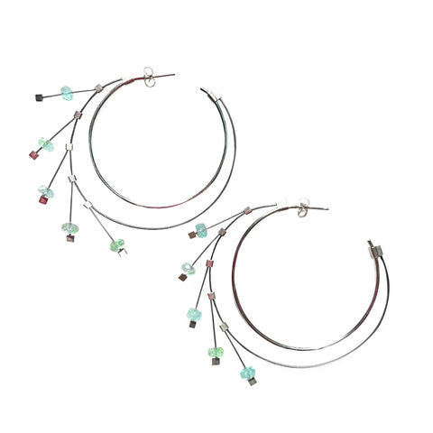 Endless spring hoop earrings in silver and aquamarine by Meghan Patrice Riley