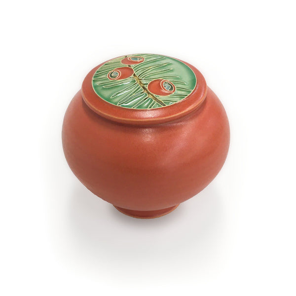 Covered ceramic jar with yew branch design