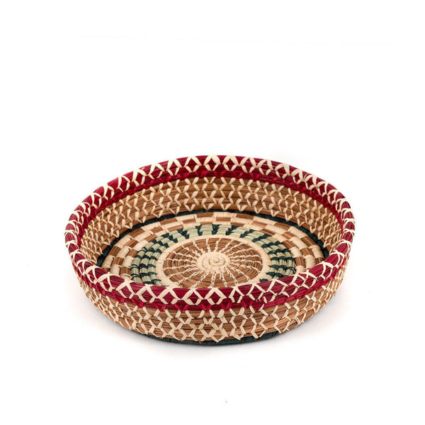 Round pine needle basket with dyed and undyed raffia