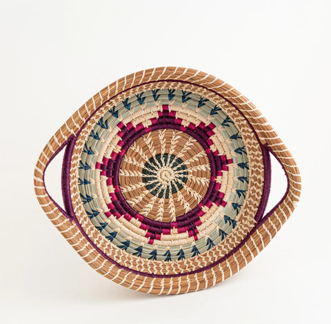 Round pine needle basket with handles with multicolor raffia