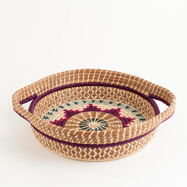 Round pine needle basket with handles with multicolor raffia