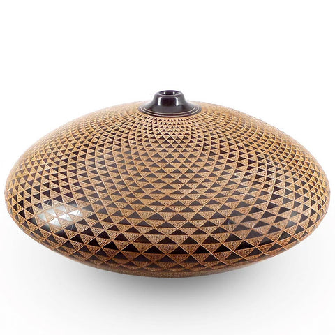 Ceramic vessel with hand-cut geometric design