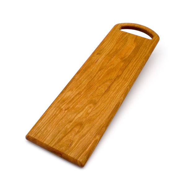 Large cherry wood serving board with oval handle