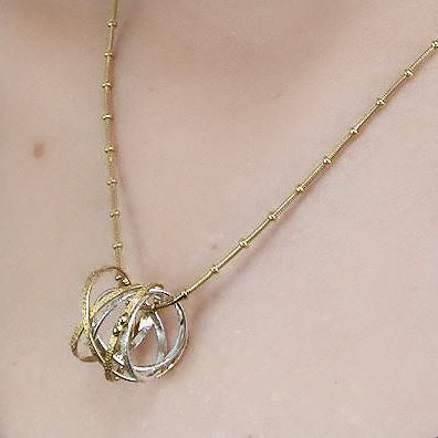 Kathleen Maley silver and gold vermeil double Mobius charm pendant