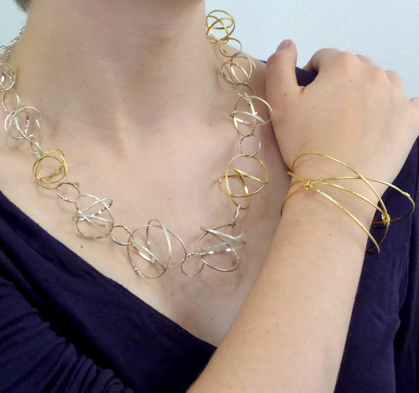 Kathleen Maley gold vermeil crossing textured bands orbit bracelet