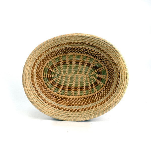 Oval pine needle basket with green wild grass