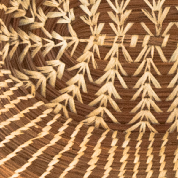 Oval pine needle basket with raffia