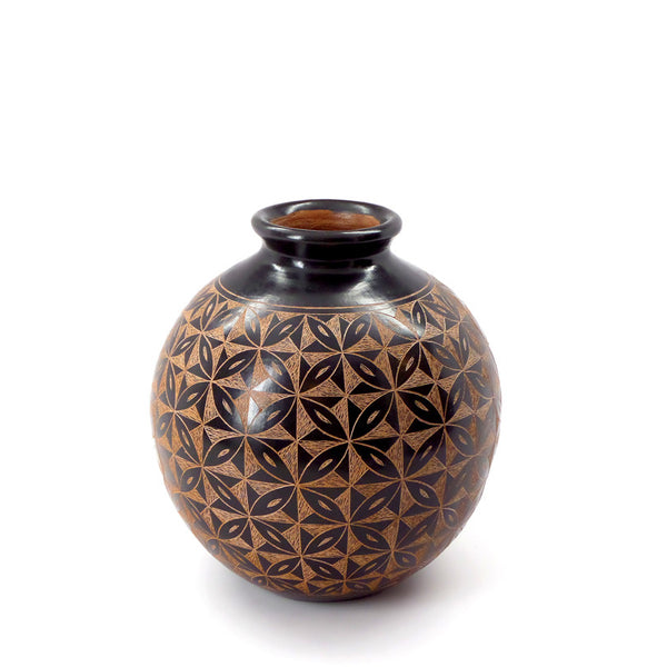 Ceramic vessel with hand-cut single-color design